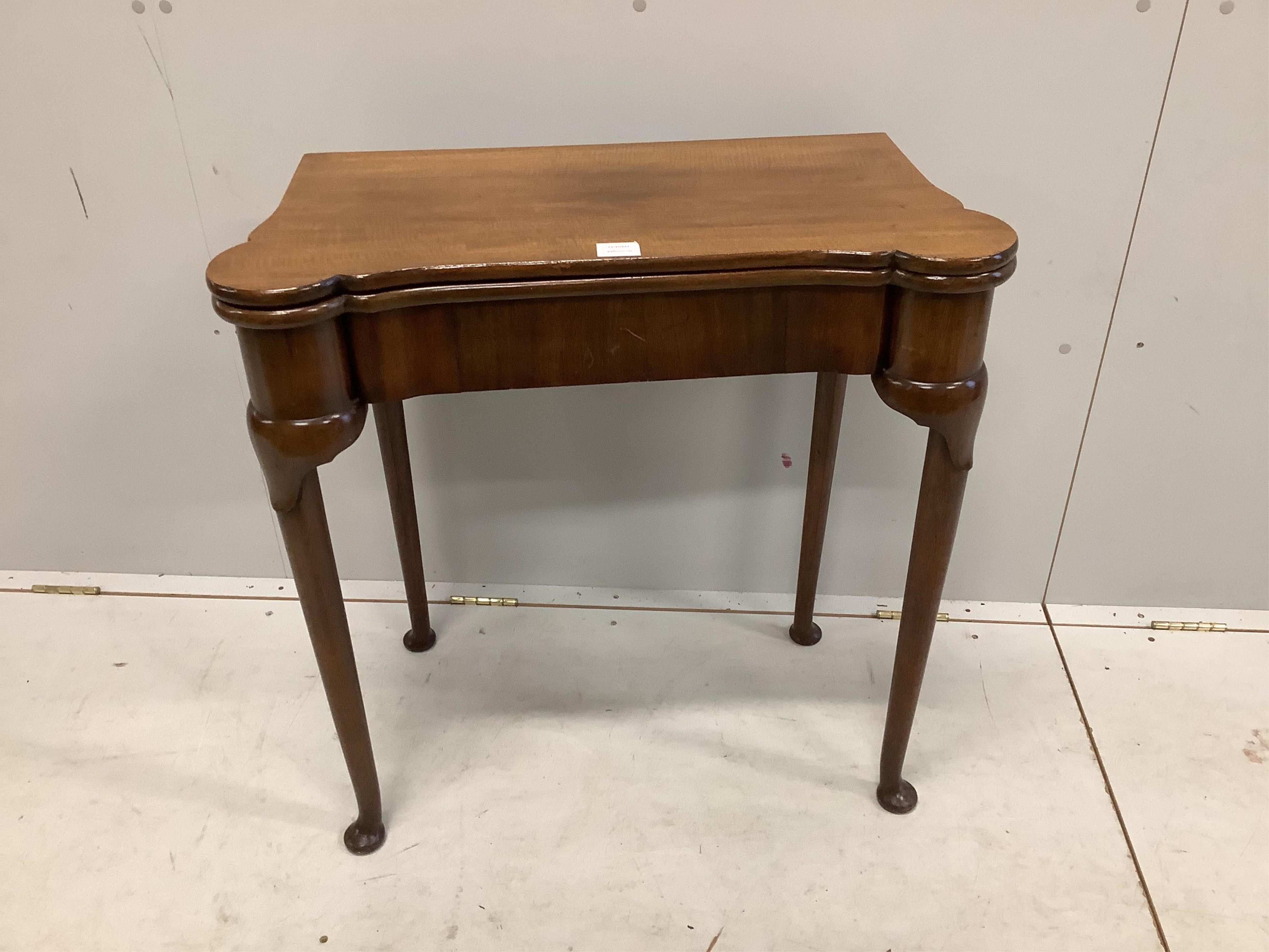 A George II style mahogany folding card table, width 75cm, depth 38cm, height 76cm. Condition - fair to good